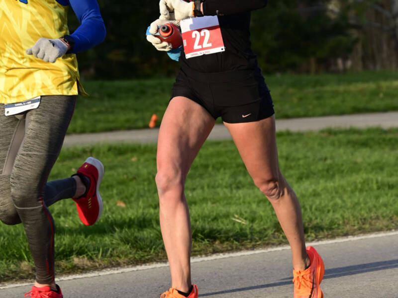 Whitney Heins running in compression sleeves