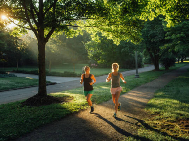 two women running at dawn