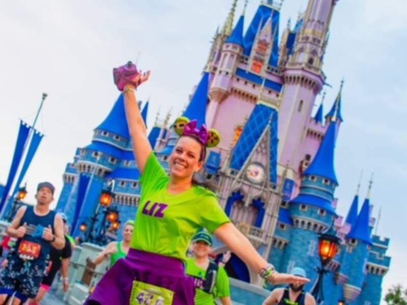 Elizabeth Minor in front of the Disney castle for a Disney race