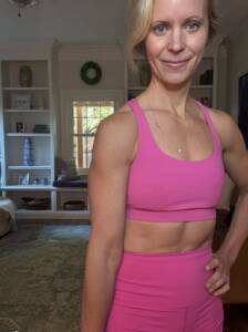 Whitney Heins in pink workout outfit