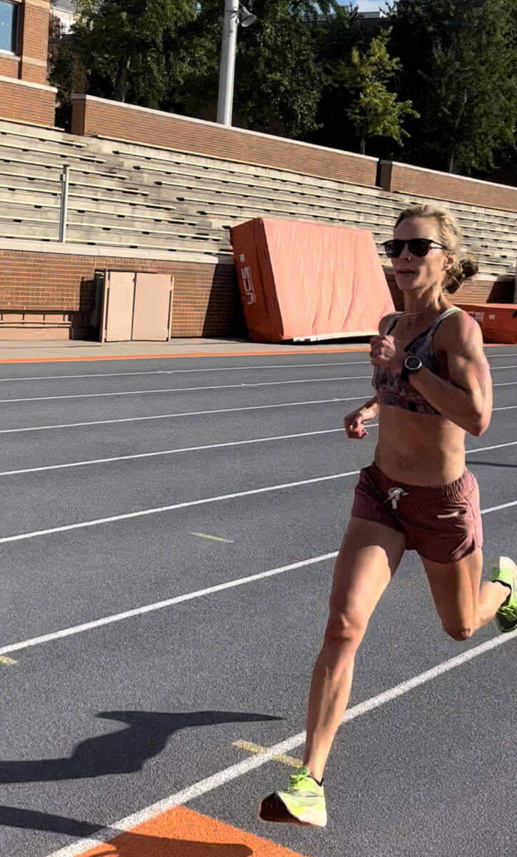 Whitney heins running on a track