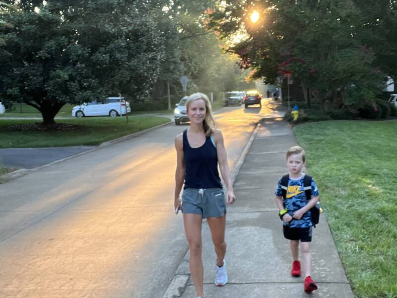 Whitney Heins walking her son to school.