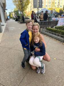 Whitney Heins with her kids after a race