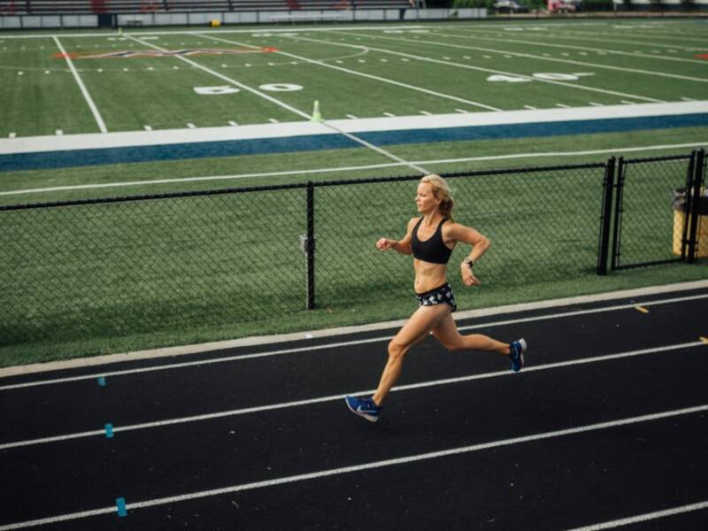 mother runner running on track.