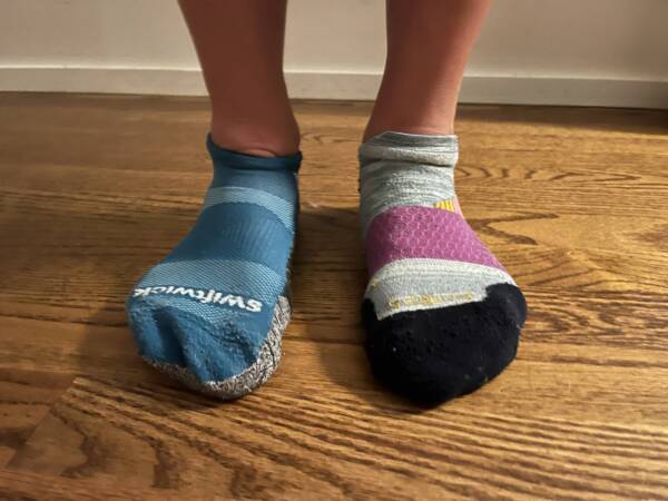 determining the best running socks for runners by standing in two different pairs