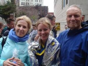 Whitney Heins with her parents in 2009 at the Boston Marathon. 