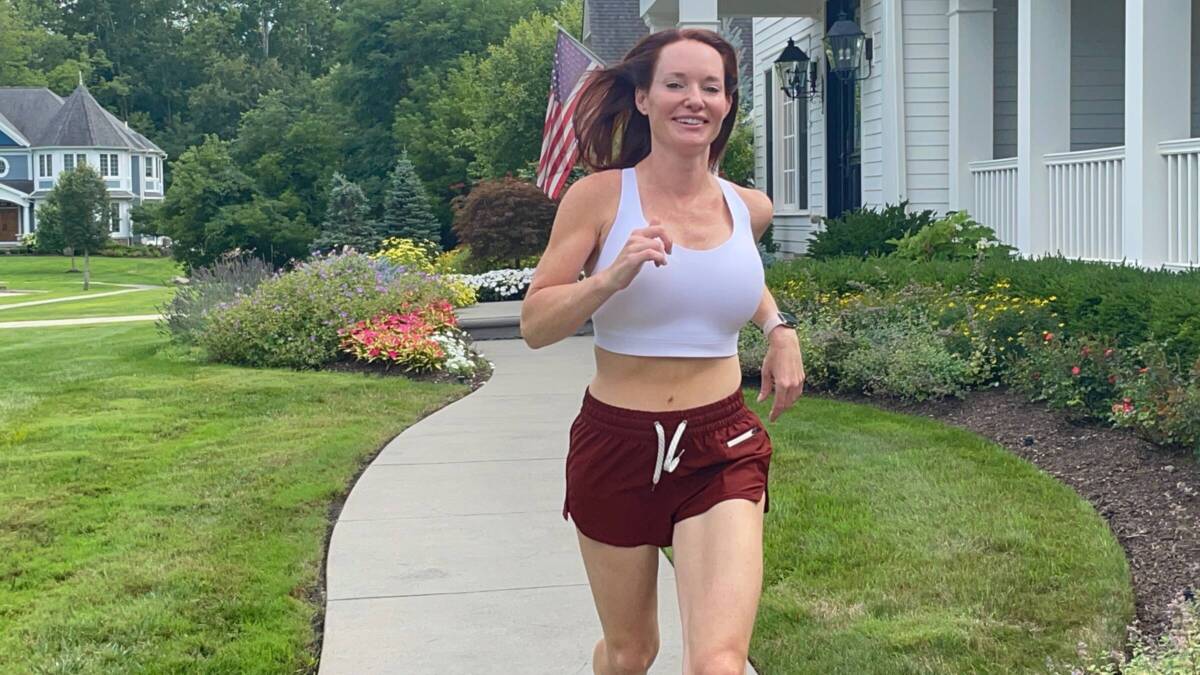 woman jogging in sports bra